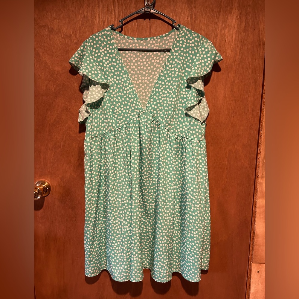 Flowy summer dress with ruffle cap sleeves.